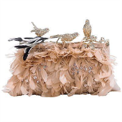 a beautiful clutch bag made of delicate, beige feathers. it features intricate, sparkling rhinestones and crystal embellishments, as well as three small, jeweled birds. the clutch is perfect for a formal occasion like a wedding or evening event.