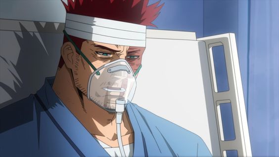 a closeup shot of an injured man with red hair in a hospital bed. he has bandages on his head and is wearing an oxygen mask. he has visible injuries on his face and a somber expression.  the setting is bright and clinical, with a white and blue color palette.  the image evokes a sense of concern and the aftermath of a struggle.
