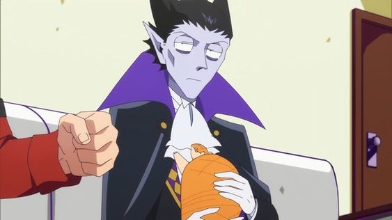 a tall, blueskinned vampire with black hair and pointy ears holds an orangewrapped baby in his arms as someone holds their fist up to the vampire's face from the left side.