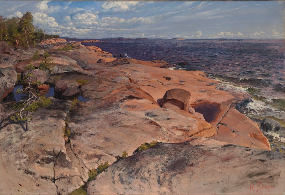 the image is an oil painting depicting a coastal landscape with pink granite rocks along the shoreline. the sea or ocean stretches out in the background under a partly cloudy sky. trees grow near the rocks on the left side of the image. the painting appears to depict the finnish archipelago, and the style is evocative of 19thcentury landscape art. a signature is visible in the lower right corner.