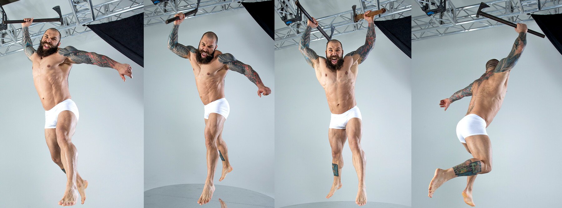 a muscular, bearded man with tattoos is shown jumping and wielding an axe in four different poses. the man is wearing white underwear and is leaping through the air. he is shown in a studio with a grey background.