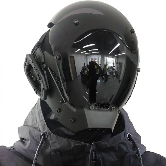 a black tactical helmet with a full face shield. the helmet is very futuristic looking.