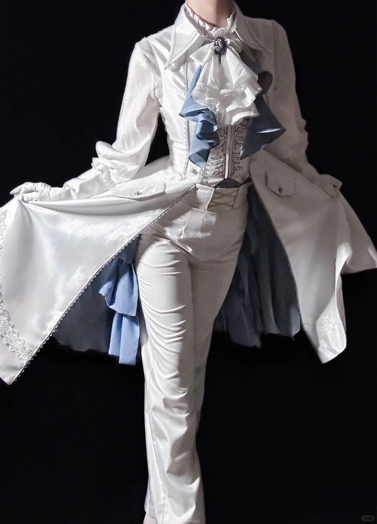 a person in a white costume with blue accents stands against a dark background. the costume includes a white ruffled top, a white jacket with a long tail, white pants, and white gloves. a blue ruffled accent is visible at the neck, and a brooch adorns the chest. the jacket is opened, revealing a blue lining, and the tail has a frilly edge.