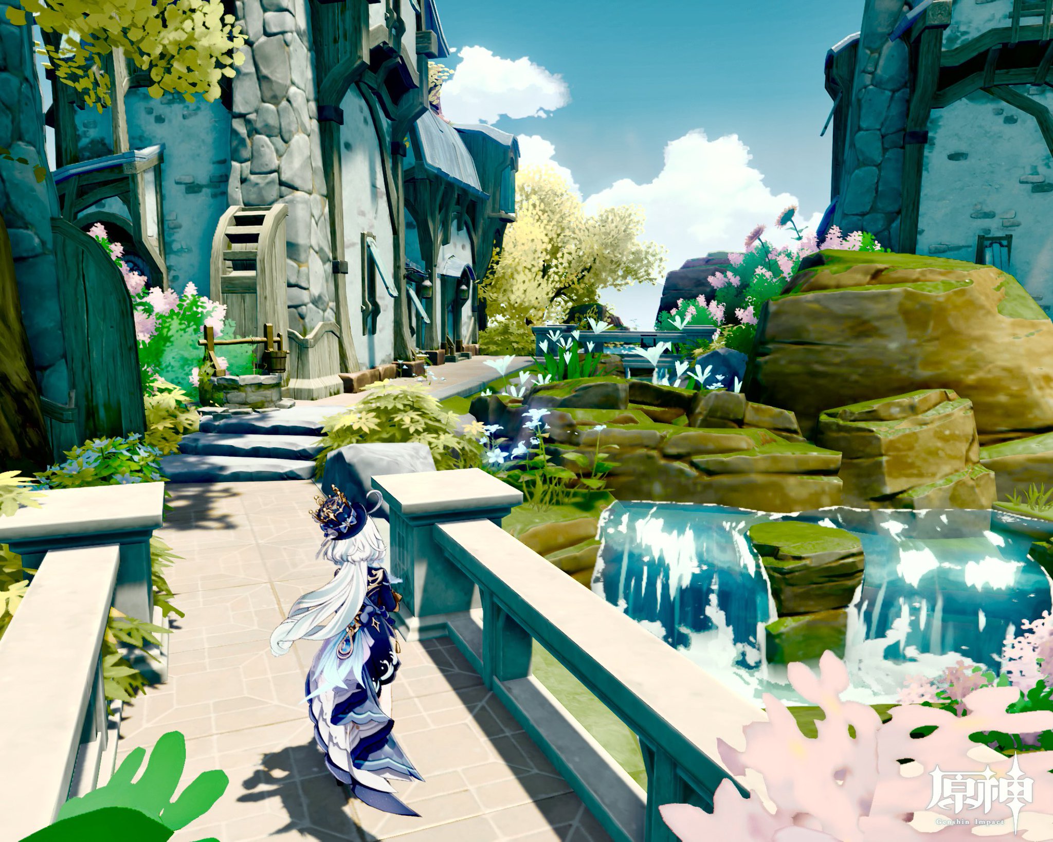 the image is a screenshot from the video game genshin impact. it depicts a charming, whimsical village setting with animestyle graphics. a female character in a flowing, elaborate outfit stands on a bridge overlooking a small, tranquil waterfall cascading over mossy rocks. the village features stone buildings with unique architecture, lush green plants, flowering bushes, and a pathway leading to the buildings. the scene is brightly lit by the sun, creating a peaceful and inviting atmosphere. the overall style is highly stylized and fantastical.