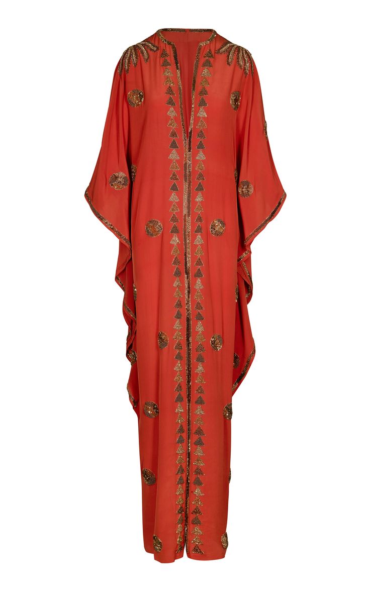 this is a beautiful red, longsleeved kaftan embroidered with gold beads. the dress has a vneckline and is flowing and elegant. it would be perfect for a special occasion or evening event. the kaftan is a timeless garment that will never go out of style, and this piece is especially chic and glamorous.  the garment is in a vintage style, yet trendy and sophisticated.  the color is vibrant and eyecatching, and the embroidery adds a touch of elegance and detail. this kaftan is sure to make you feel confident and beautiful.