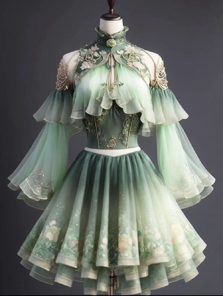 a green fantasyinspired dress is displayed on a mannequin. the dress is short with a layered skirt and sheer, flowing sleeves. the bodice is fitted and embellished with intricate gold embroidery and floral details. the fabric fades from a darker green at the top to a lighter green at the bottom, creating an ethereal effect. the dress is reminiscent of fairy or elflike attire, suggesting a whimsical and enchanting style.
