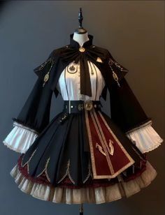 the image showcases a meticulously crafted black and burgundy lolita fashion dress displayed on a mannequin. the dress boasts intricate golden embroidery and detailing, particularly on the bodice and skirt. a highnecked white blouse with a delicate bow adorns the upper half, while the skirt features an elegant asymmetrical design with a prominent burgundy panel. puffy sleeves with white cuffs and a matching belt cinching the waist add to the overall charm of the attire.