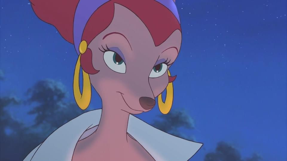 closeup shot of roxanne from disney's "a goofy movie." she is a stylized anthropomorphic female deer with red hair, large gold hoop earrings, and a purple headband.  she's wearing a white jacket or coat and has a confident, slightly sly expression on her face. the background is a twilight sky with stars. the image is from the animated film.