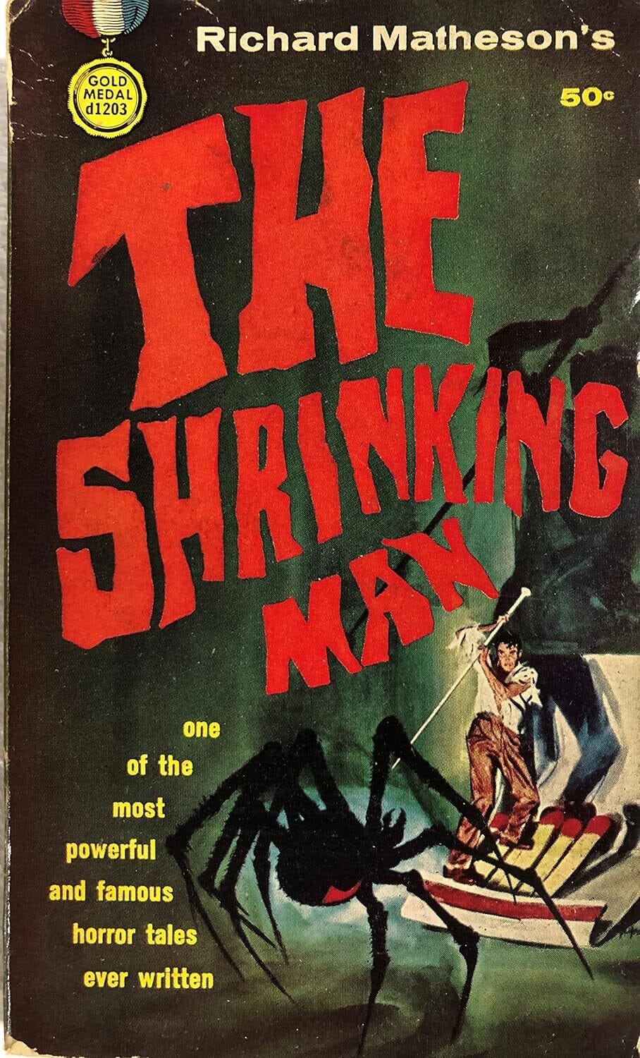 he image is a scan of a vintage paperback book cover for richard matheson's "the shrinking man." the cover features bold, red lettering for the title, set against a dark green background. a large black spider is prominently displayed in the foreground, with a man in the background appearing small relative to the spider, illustrating the book's premise. the cover also includes a gold medal books logo and price (50¢). the overall style is typical of 1950s paperback horror and science fiction.