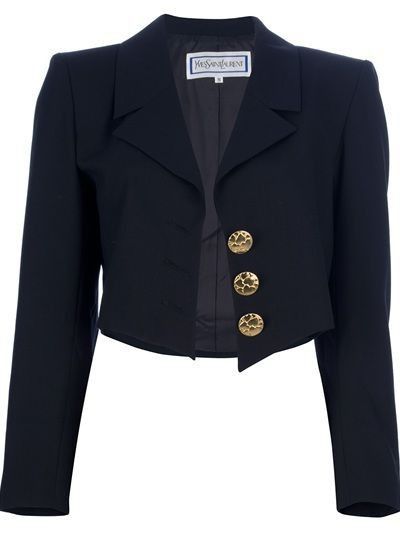 a navy blue yves saint laurent blazer with three gold buttons. the blazer is cropped and has a label visible at the neckline.