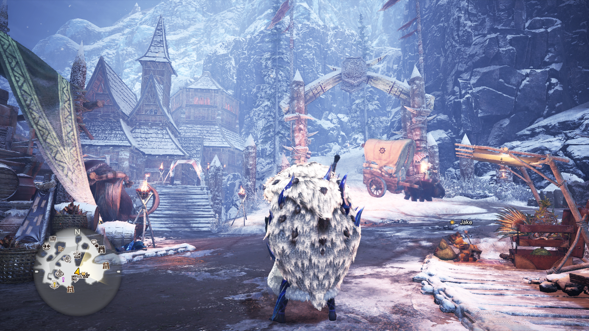 this image is a screenshot from the video game monster hunter world: iceborne. it shows the player character from behind, standing in the center of seliana, the game's hub area. the character is wearing a large, white, furry armor set. the environment is snowy and mountainous, with several buildings and npcs visible in the background. the overall lighting is overcast and ambient, creating a cold and atmospheric feel.