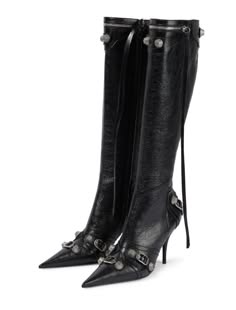 a pair of black leather kneehigh boots with stiletto heels and pointed toes. the boots feature buckle detailing and are adorned with silver studs. they appear to be a highend fashion item. the boots are photographed against a white background.