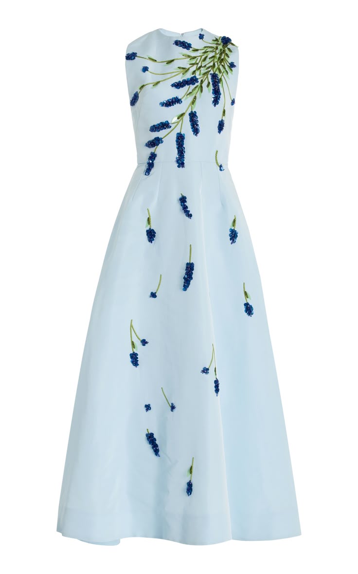 a light blue, sleeveless formal dress with blue floral embroidery cascading down the front. the dress has an aline silhouette.