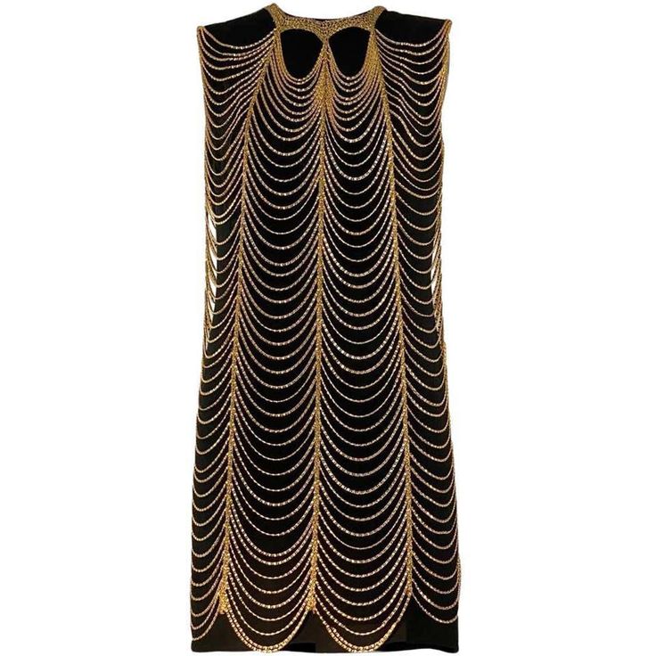 a sleeveless black dress with a gold chain halter neck design. the chains are layered and drape down the front of the dress. the dress has a fitted silhouette and is a statement piece perfect for a special occasion.