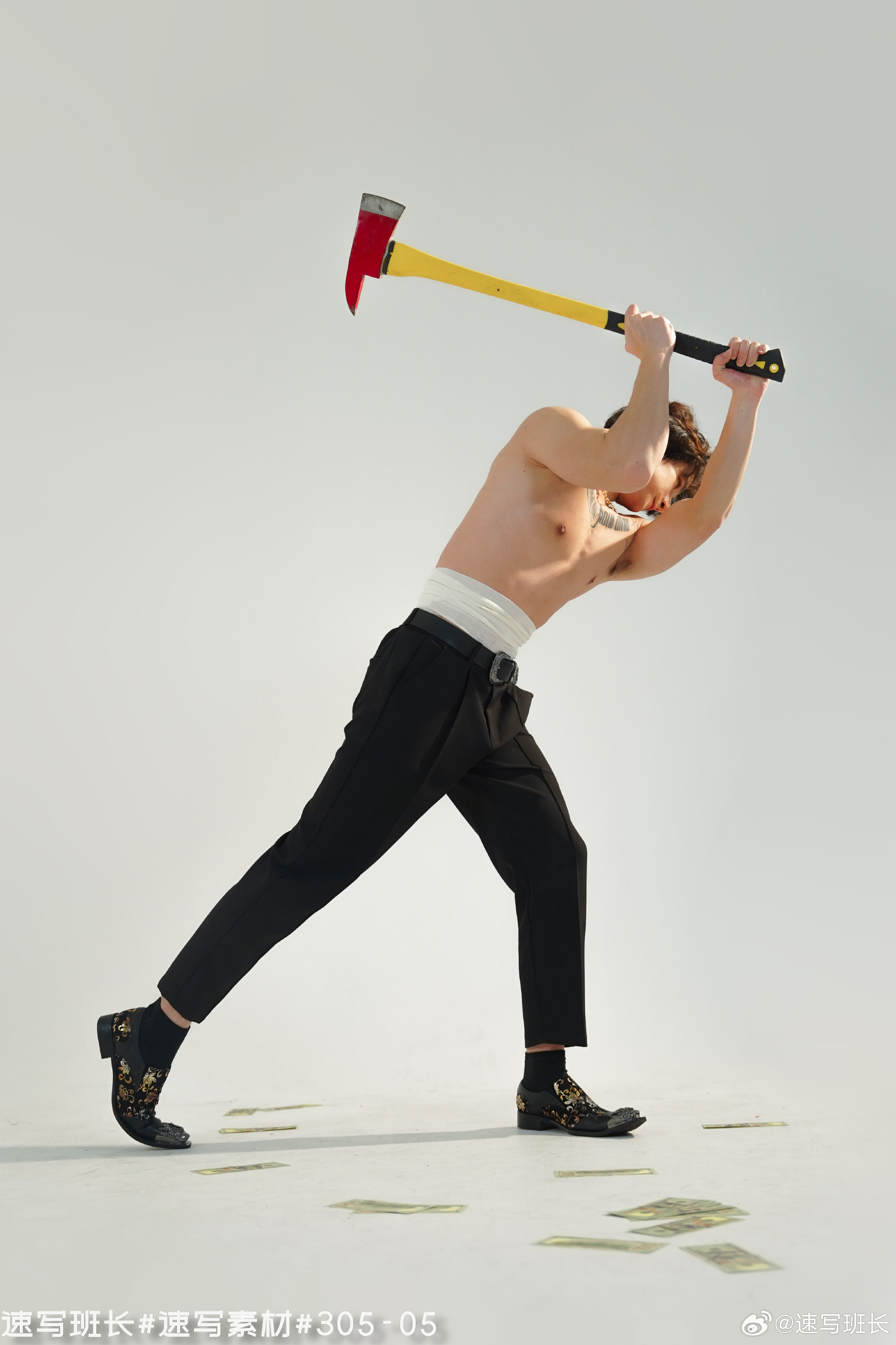 a shirtless man wearing black pants and patterned loafers is dramatically swinging a fire axe over his head. he is surrounded by scattered paper money on a white studio backdrop. the image exudes a sense of power and destruction, contrasting wealth and physical force.