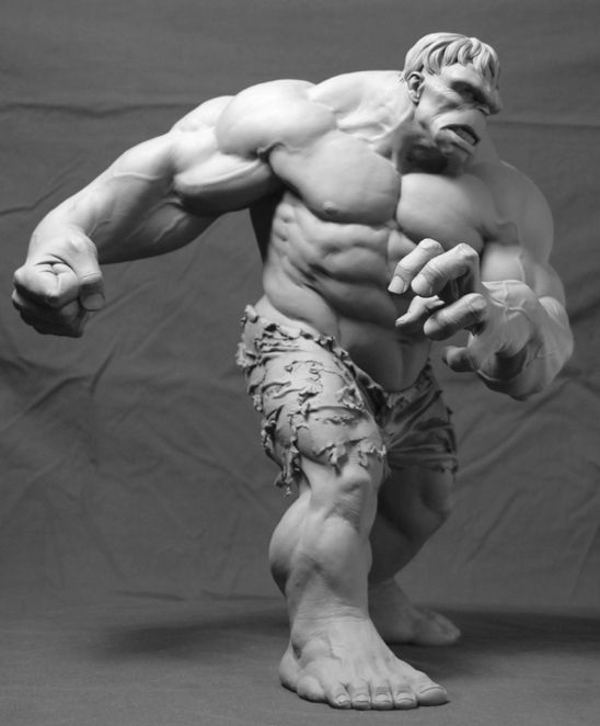 this is a black and white image of a clay sculpture of the hulk. the hulk is standing with his fists clenched and his teeth gritted. he is wearing ripped pants and his muscles are very defined. the background of the image is a dark gray. the sculpture is very detailed and realistic.