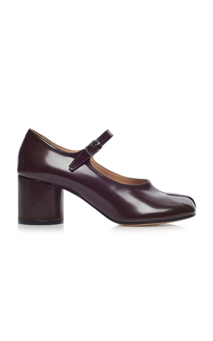 a pair of brown leather women's shoes with a square toe and a block heel. the shoes have a buckle strap around the ankle.
