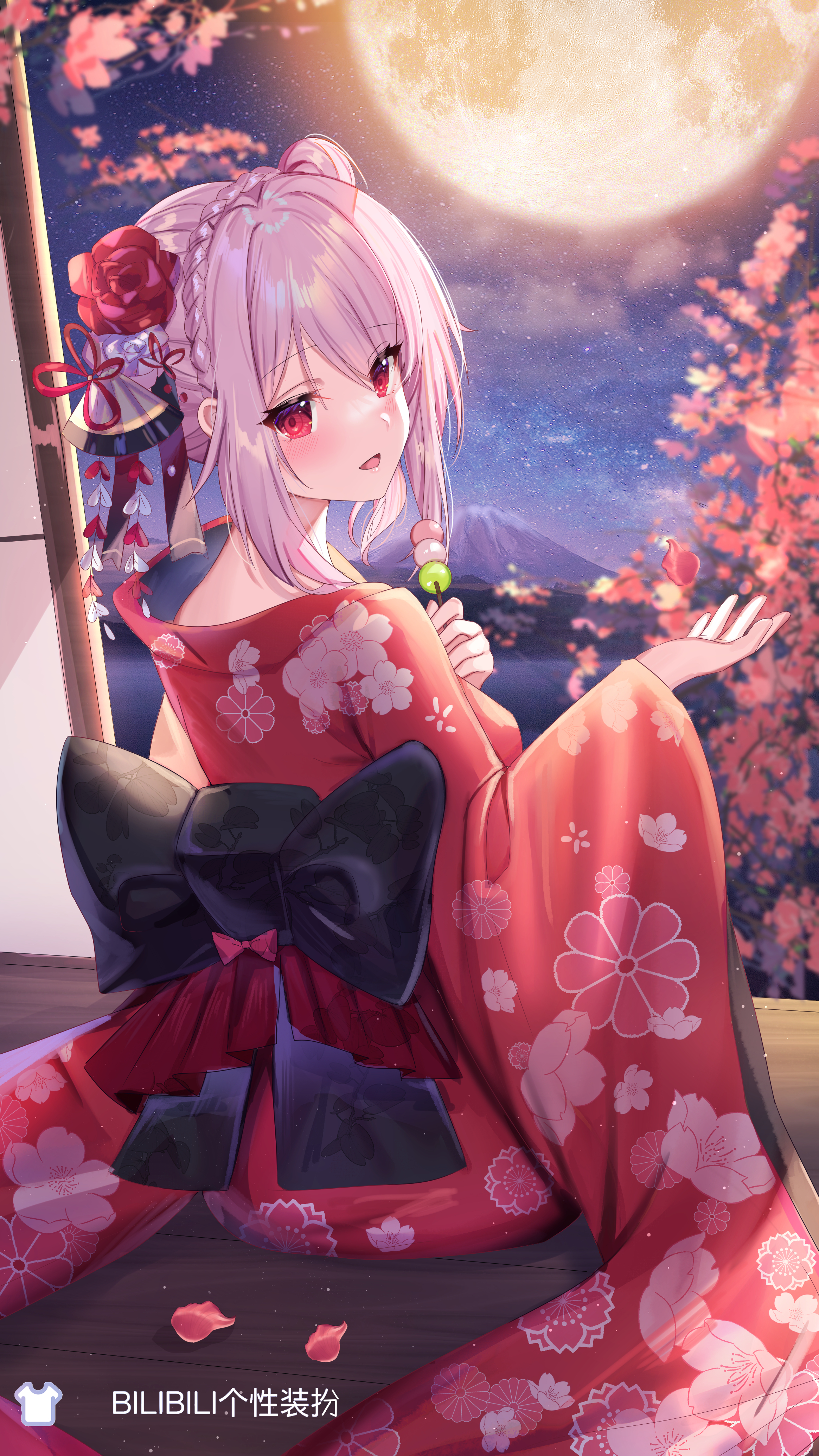 the image is a digital illustration of a beautiful anime girl. she has long, pink hair styled in a halfupdo with a rose and other decorative elements. her eyes are a striking red. she's wearing a vibrant red kimono adorned with pink cherry blossom patterns, and a large black bow accents the back. the girl holds a dango (japanese sweet dumpling) on a stick. she's posed gracefully, looking out at a night scene featuring a full moon, cherry blossom trees, and a mountain in the distance. the style is highly polished and evocative of traditional japanese aesthetics and anime artwork. the watermark "bilibili个 性装扮" suggests the artwork originates from or is associated with the bilibili platform.  pink petals are scattered on the ground around her.