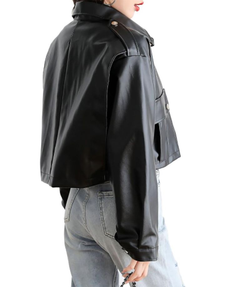 a woman wearing a black leather jacket and blue jeans, from the back view.