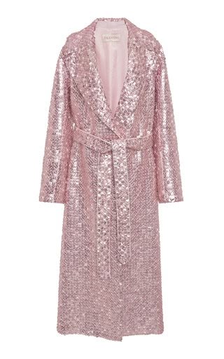 a pink sequined wrap coat with long sleeves and a tie waist.