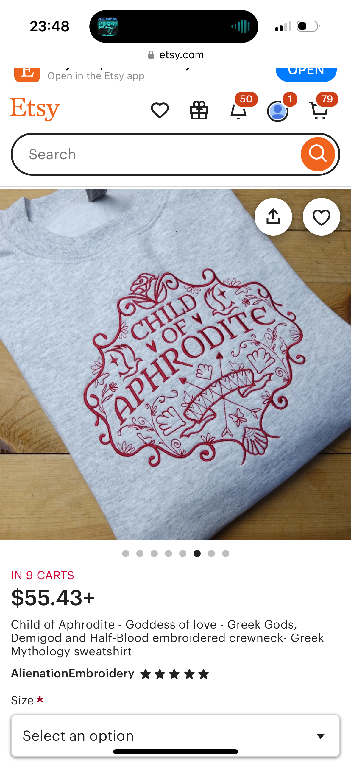 this is an etsy product listing for a grey embroidered sweatshirt that reads "child of aphrodite." it is listed as being in 9 carts and priced at $55.43. the listing is by the seller "alienationembroidery" and features several other details about the product, such as it being a greek mythologythemed sweatshirt. it also provides several sizing options.