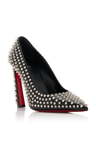 a pair of black stiletto heels covered in silver studs, with a signature red bottom. the heels are pointytoed and made of leather. they are a popular style of designer heel, and are often worn for special occasions.