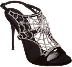 a closeup shot of a single black suede stiletto heel sandal adorned with a intricate rhinestone spiderweb design. the shoe is elegantly styled, highlighting its luxurious and glamorous aspects. the image clearly shows the details of the shoe's design, material, and construction.