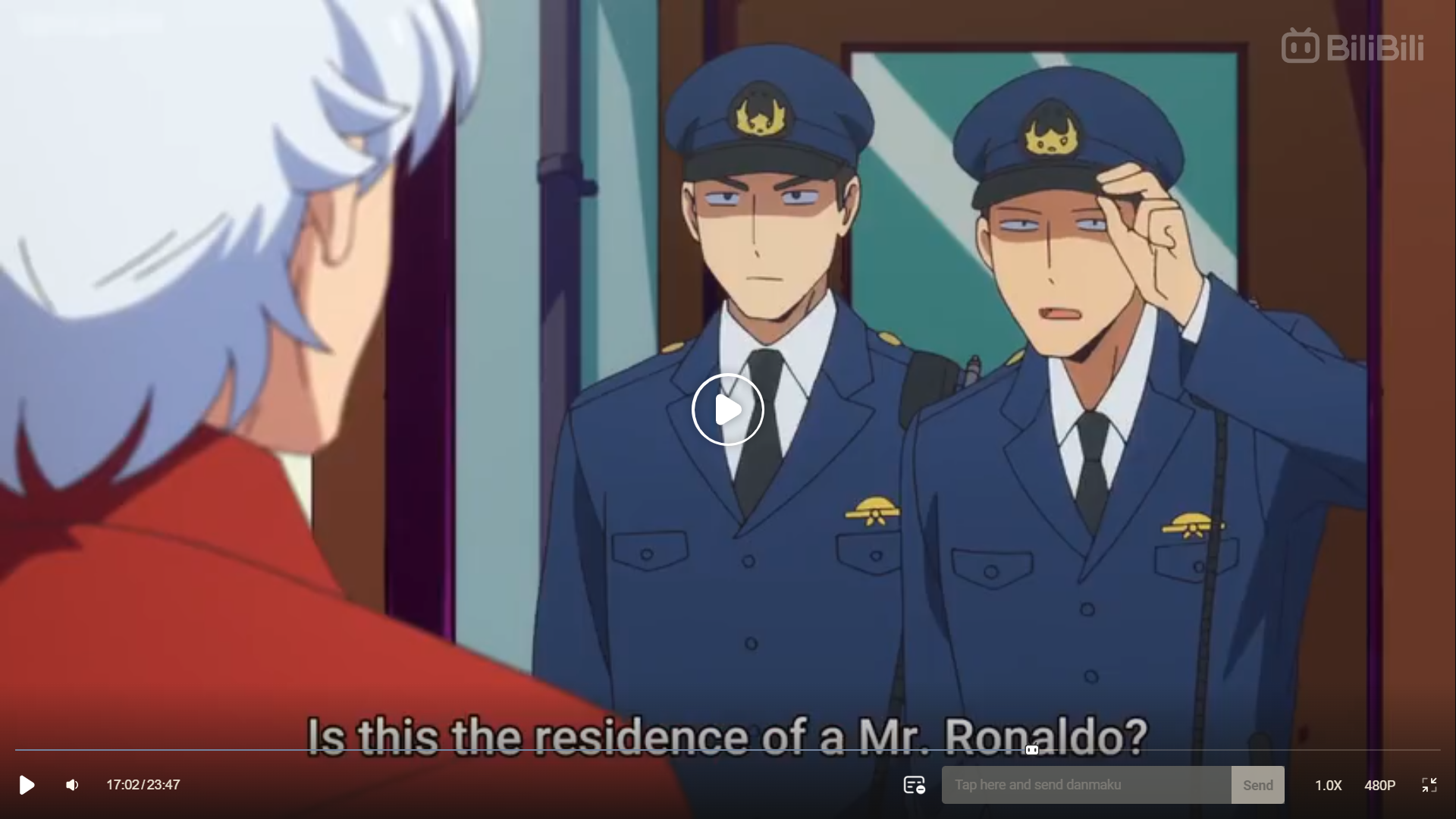 the image is a screenshot of what looks to be an anime. there are three men in the image. one man, who is wearing a red suit jacket with white hair, has his back to the camera. in front of him are two men dressed in navy blue policestyle uniforms with light blue dress shirts underneath. the man on the right is nervously adjusting his hat. below them is a subtitle that reads "is this the residence of a mr. ronaldo?" ```
