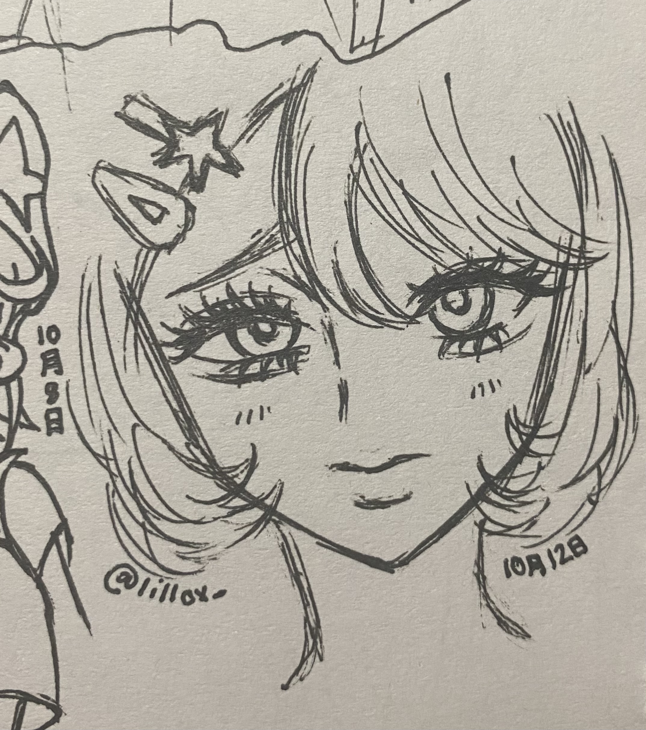 the image is a closeup shot of a handdrawn sketch or doodle of an animestyle girl's face.  the style is reminiscent of manga, with large expressive eyes and detailed hair.  the drawing is done in pen or ink, in black and white on what appears to be light beige paper.  there's a starlike decoration on the girl's hair. the artist's signature or handle, "@lillox," is visible along with date markings ("10月9日" and "10月12日", likely representing october 9th and 12th). the overall impression is of a quick yet expressive piece of original character art.