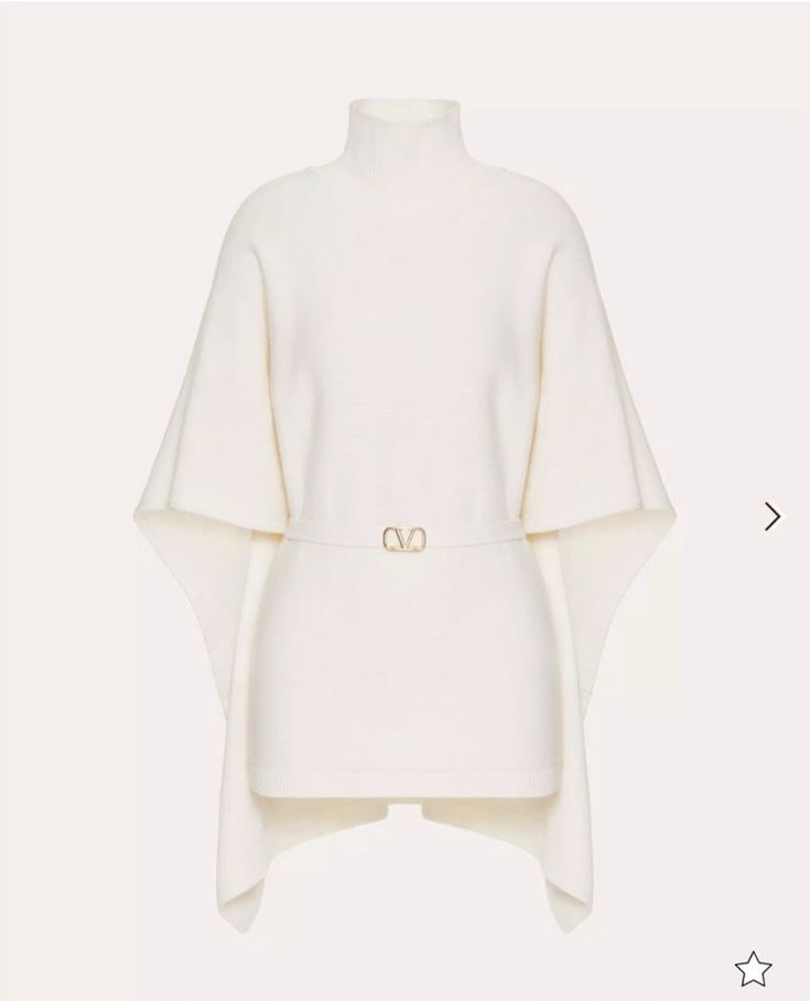 a white sweater with a turtleneck and long sleeves. it's knitwear and has a vneck design. the sweater is draped in a relaxed and oversized fit, creating a chic and comfortable style. the design is simple and modern, with a minimalist approach. the sweater is perfect for casual and elegant occasions. the fabric is soft and warm, providing comfort and style. the sweater is a versatile piece that can be dressed up or down.