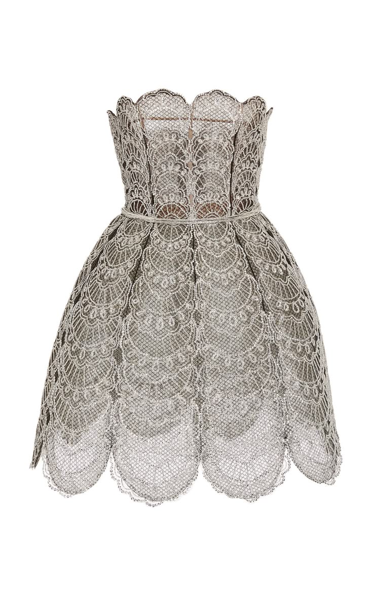 a silver, strapless dress with an intricate lace pattern, scalloped hem, and fitted waist. the dress is embroidered with a floral pattern and has a light lining underneath the lace. the hem is scalloped, giving it a delicate, feminine look.