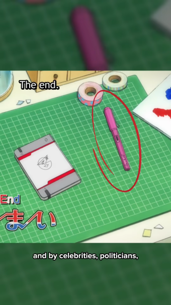 the image shows a closeup of a green mat on a white table. on the mat are a pink pen, a notebook, and some other objects. the notebook has a red design on it. there are also some other objects in the image, including a piece of paper with a blue and white circle on it, and another piece of paper with a red and white circle on it. the text "the end" is written on the top left corner of the image. the text "end" and japanese characters are written on the bottom left corner of the image. the text "and by celebrities, politicians" is written on the bottom of the image.
