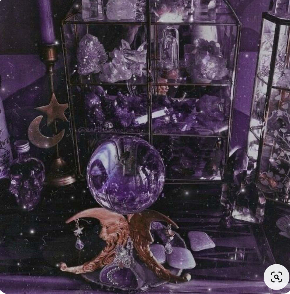 the image depicts a richly detailed scene steeped in a dark purple aesthetic.  the focal point is a crystal ball perched on an ornate, crescent moonshaped stand.  surrounding the crystal ball are various glass display cases filled with amethyst crystals and other purple stones.  other mystical objects are present, including a crescent moon and star candle holder, a candle, and small bottles that add to the overall atmosphere of divination or witchcraft. the overall effect is one of mystery, magic, and enchanting spirituality.  the image has a slightly grainy, filtered appearance that enhances its mystical and ethereal quality.
