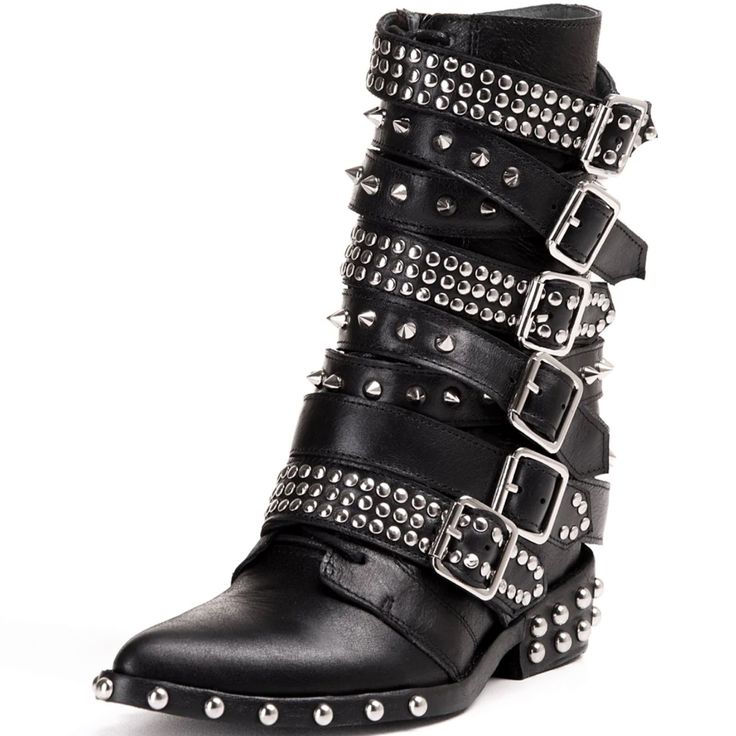 the image shows a pair of women's black leather ankle boots.  the boots are highly detailed with multiple straps featuring silver studs and buckles that wrap around the ankle area. the boots have a pointed toe and a low block heel. the overall style is edgy and reminiscent of biker or rock and roll fashion. the boots are shown from a threequarter angle, showcasing their intricate design and detailing.
