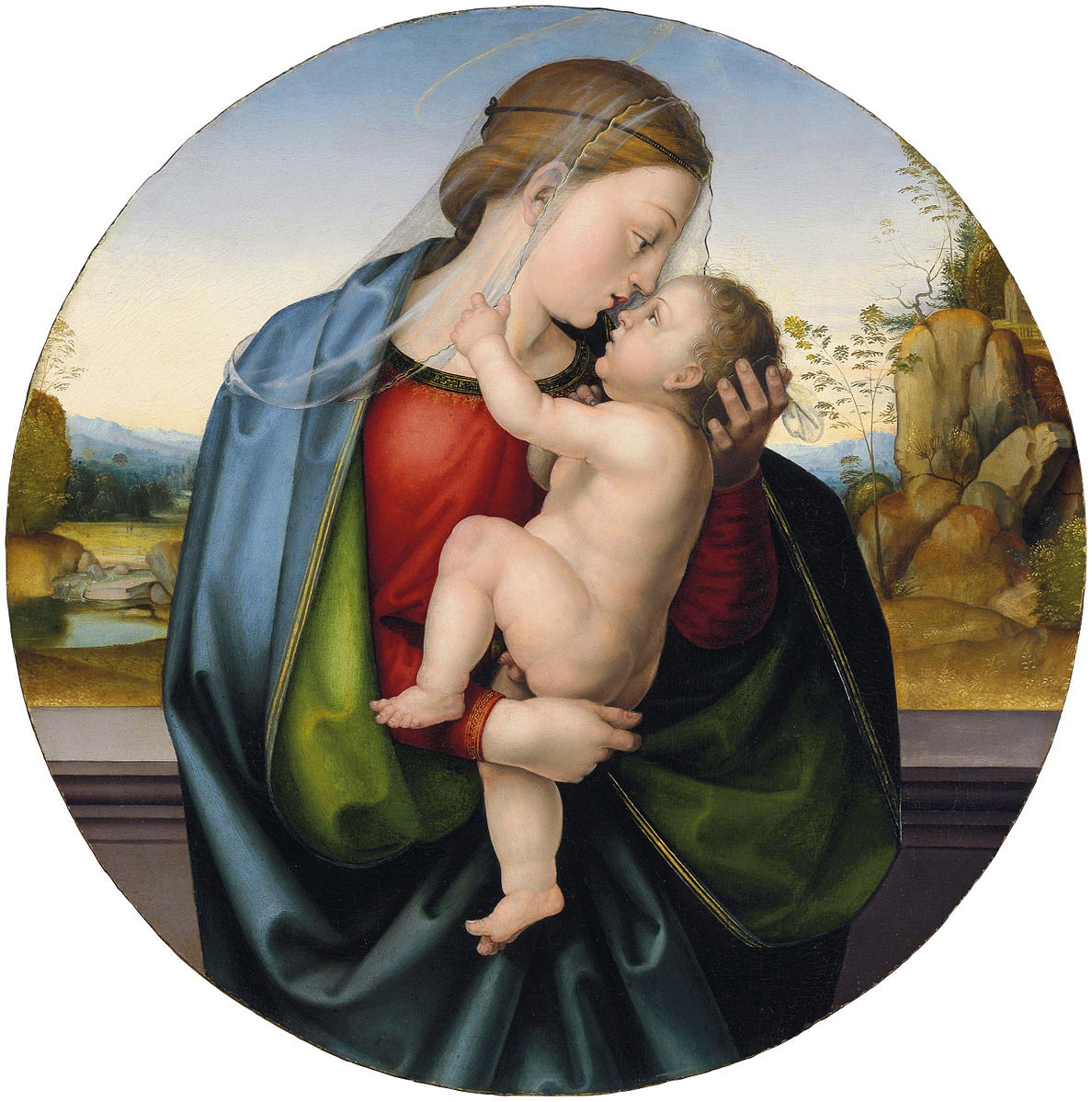 the image is a roundel painting of the madonna and child. the virgin mary, depicted in a red dress and a blue and green robe, cradles the infant jesus in her arms. both figures are fairskinned and have halos above their heads. the virgin mary is wearing a sheer veil over her head. the background features a landscape with trees, rocks, and a body of water. the painting is rendered in a classical style with soft lighting and delicate details.