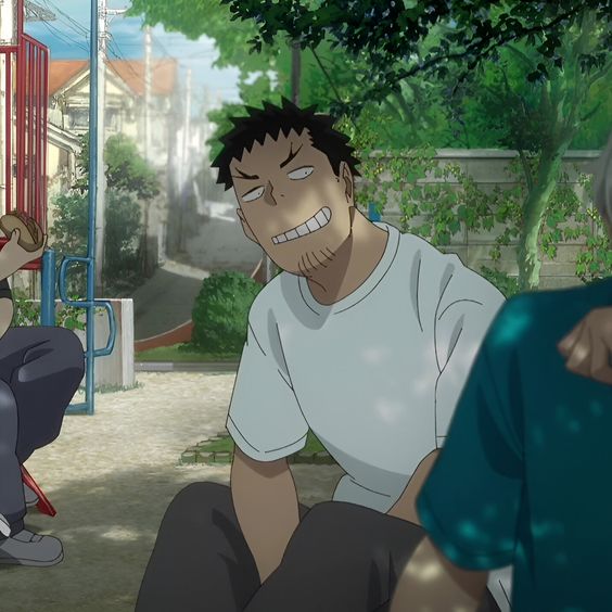 the image is a screenshot from an anime and shows three male characters, likely boys or young men, spending time together in a park on a sunny day. two are seated facing forward while the third, wearing a white shirt, is turned towards them with a mischievous grin. the scene suggests a casual, friendly atmosphere. lush green trees and foliage dominate the background, highlighting the warmth of the summer day.
