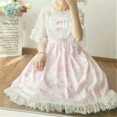 a young woman wearing a pink lolita fashion dress is sitting on the floor. the dress features white lace trim, a peter pan collar, and a print of cute cartoon animals. the dress is very full and has a lot of volume. the woman is wearing her hair in loose curls and is looking down at the camera. the overall aesthetic of the image is very dreamy and girly.
