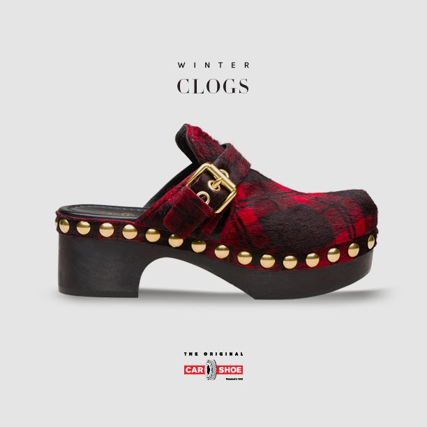 a red and black plaid clog with a gold buckle and gold studding along the platform. the shoe has a black heel and is displayed on a light grey background. "winter clogs" is written above the shoe, and the car shoe logo is below.