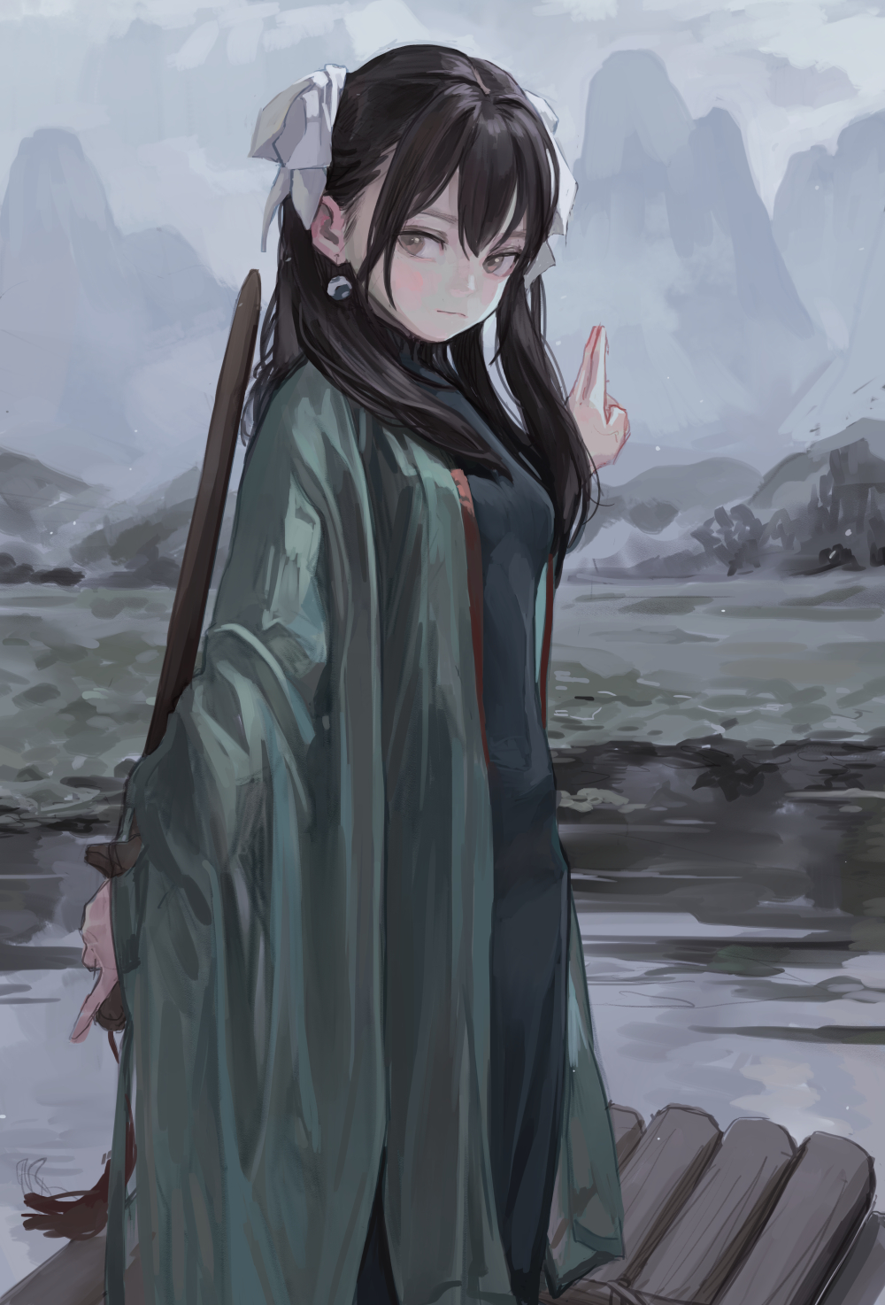 an anime girl stands on a small wooden boat in front of a misty mountain range. she wears a dark dress under a flowing green kimono. her black hair is styled with ribbons and buns. she has an earring in one ear. she holds a long staff. the overall tone is moody and pale.