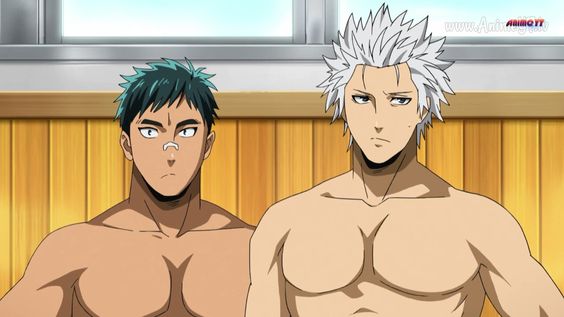 two shirtless muscular men with toned physiques are in a bathhouse with tan wood paneling. one man has spiky gray hair, while the other has short dark green hair and a bandaid on his nose. both men are staring directly at the viewer with serious expressions.