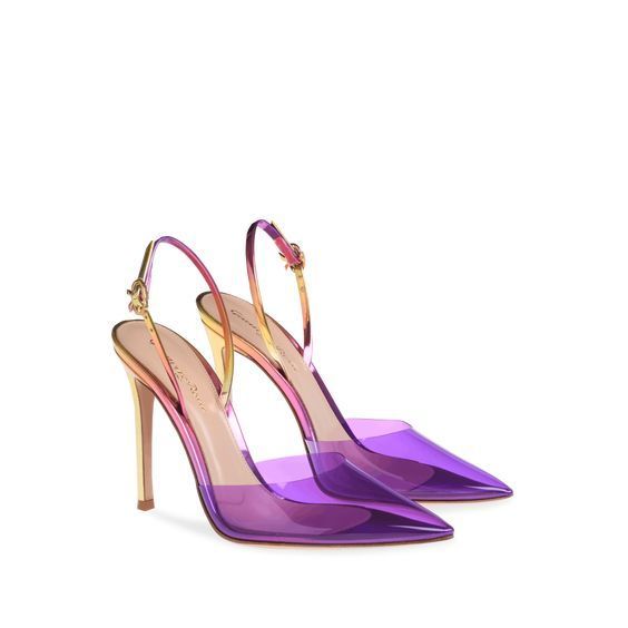 the image shows a pair of women's casadei slingback high heels.  the shoes are a striking ombre design, transitioning from a light pink/gold tone at the heel to a deep purple at the toe. the upper part of the shoe is made of a transparent material, likely pvc, which allows the gradient color to show through. the heels are pointedtoe and have a delicate gold buckle closure on the ankle strap.  the shoes are positioned at a slight angle, showcasing their shape and color beautifully.