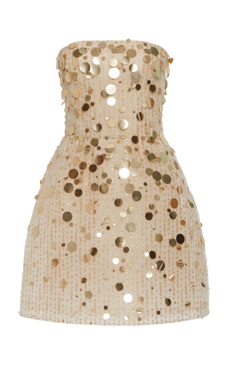 a strapless mini dress covered in gold sequins is shown. the dress is a light beige color with gold sequins of varying sizes scattered across the entire dress.