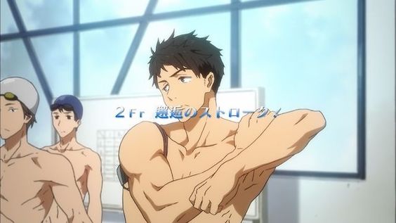 an animestyle drawing of a muscular young man with dark hair, standing in front of a window in a swimming pool setting. he is shirtless and appears to be preparing for a swimming competition, as suggested by the japanese text on the image and his focused expression. he is stretching his right arm, highlighting his physique and athletic build.  the color palette is bright and airy, reflecting the welllit indoor pool environment.
