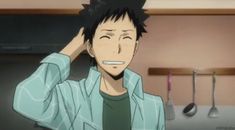 a young anime man with spiky black hair and a friendly smile is scratching his head. he's wearing a teal overshirt over a dark green shirt. the background suggests he's in a kitchen, as there are kitchen utensils hanging on a rack. the lighting is bright and emphasizes the cheerful atmosphere of the scene.