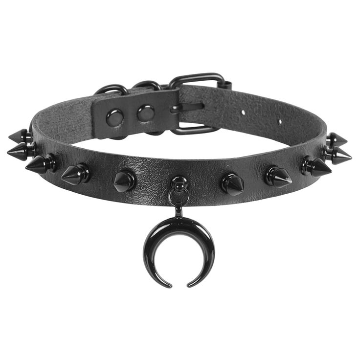 a black leather choker with metal spikes and a crescent moon pendant is shown on a white background. the choker has a beltstyle closure with multiple holes for adjustable sizing. metal studs are spaced evenly around the band, with longer spikes towards the edges. a black crescent moon hangs from a metal ring attached to the center of the choker. the style is gothic and punkinspired.