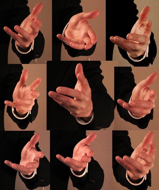 the image shows nine photos of a hand in various poses. the hand is wearing a black suit jacket and a white shirt. the background is a light brown color. the photos are taken from different angles and perspectives, showcasing various hand gestures. the lighting is artificial, creating a studiolike setting.  the image appears to be a reference for drawing or painting hands.