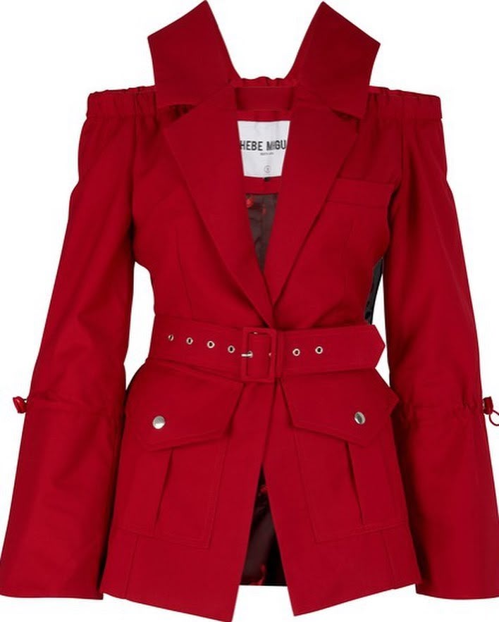 red offtheshoulder blazer with a belt and flap pockets.