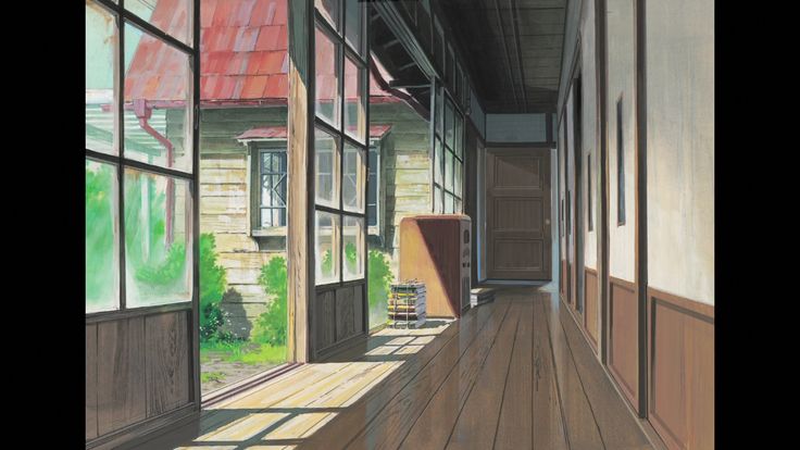 this is a brightly lit hallway of a house, made primarily of wood. the exterior is visible through large windows.  sunlight is shining through the windows illuminating most of the hallway.