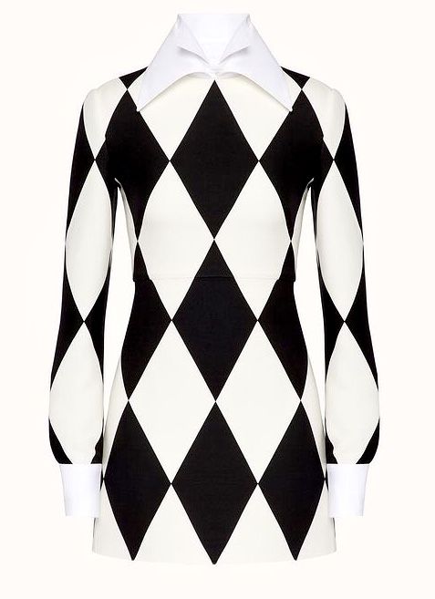 a black and white harlequin diamond pattern mini dress with long sleeves and a white collar.