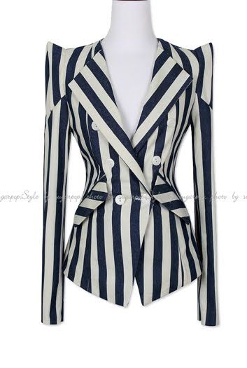 a striped blazer on a mannequin. the blazer is striped with white and navy blue, and it is doublebreasted.